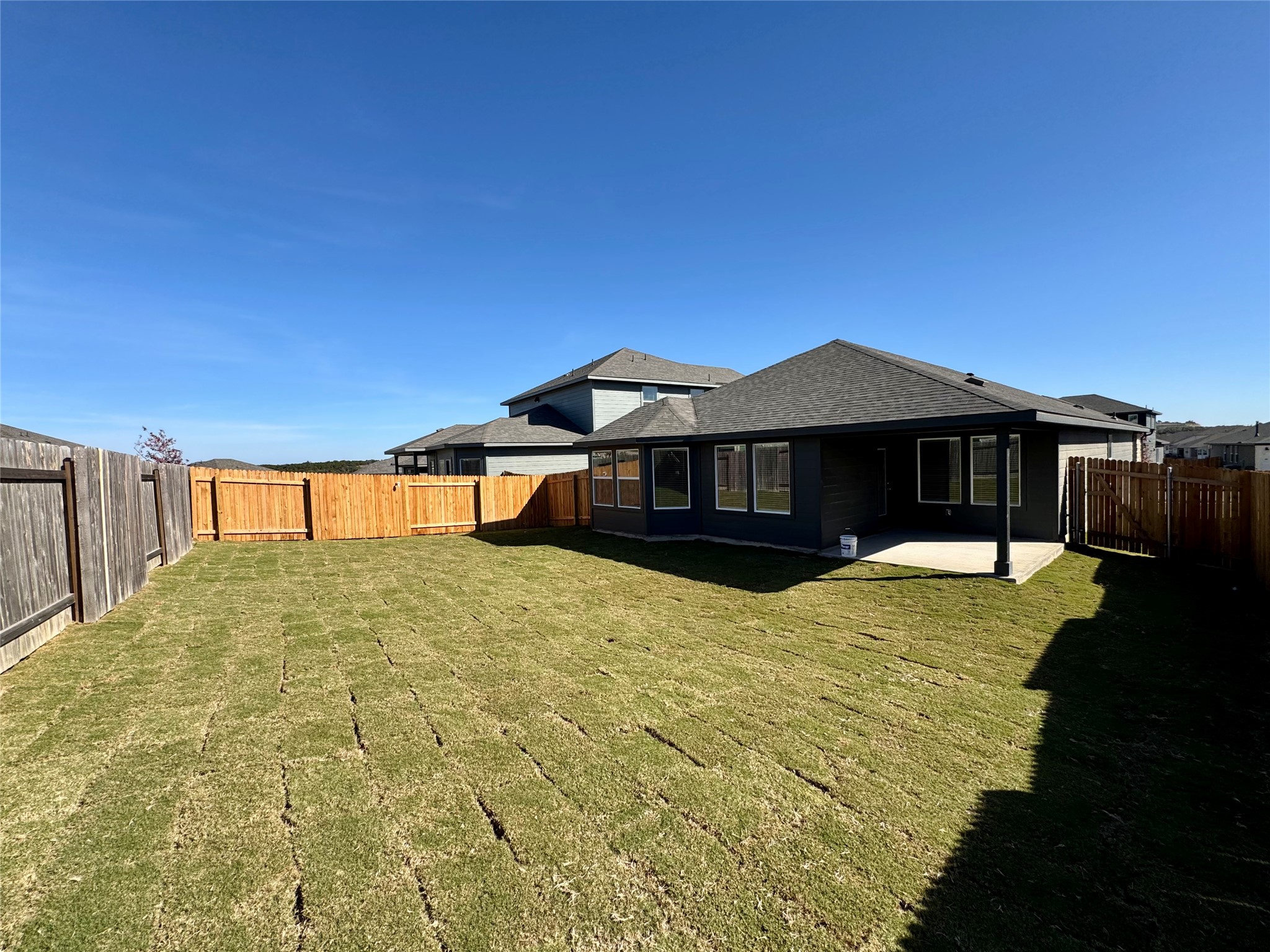 470 El Capitan Loop Dripping Springs, TX 78620 - Photo 5 of 26 a front view of a house with a yard