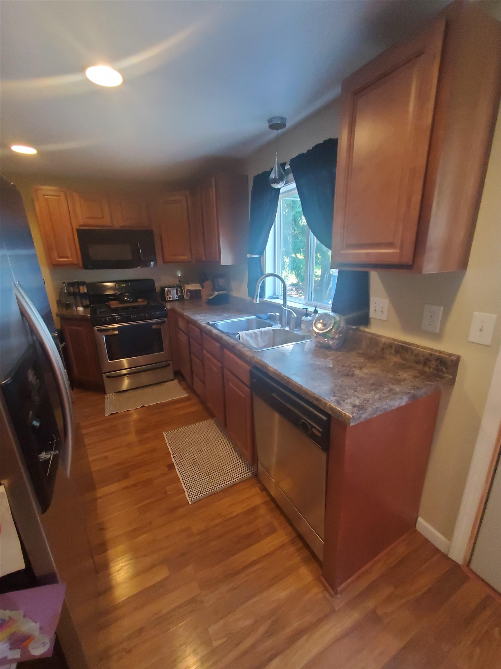 1130 Ritsher Street Beloit, WI 53511 - Photo 11 of 14 a kitchen with stainless steel appliances granite countertop a sink and a stove