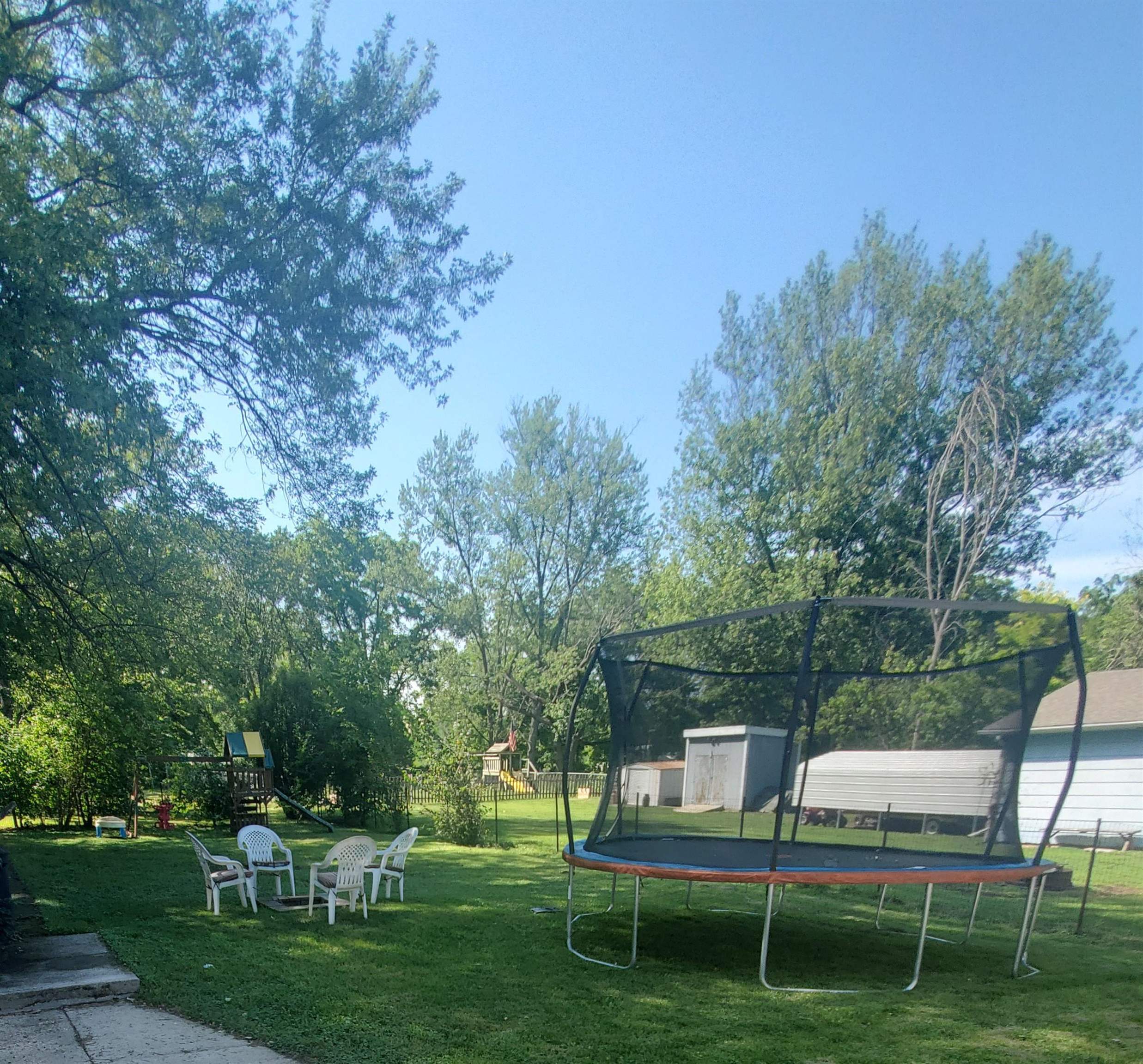 1130 Ritsher Street Beloit, WI 53511 - Photo 3 of 14 a view of backyard with seating space and trees