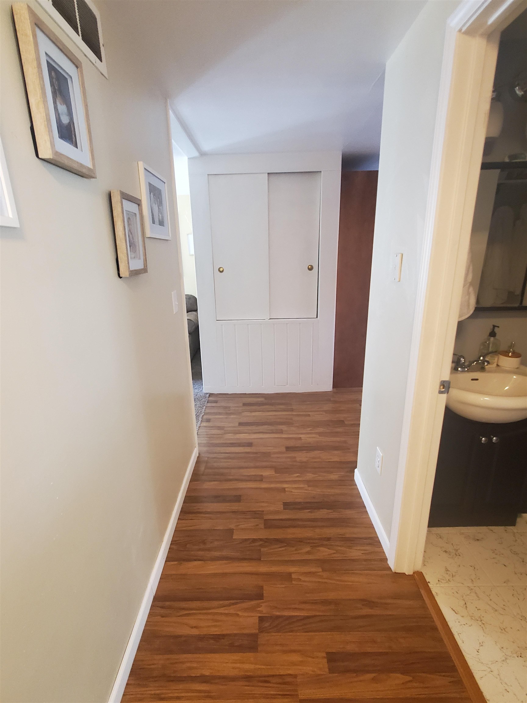 1130 Ritsher Street Beloit, WI 53511 - Photo 8 of 14 a view of a hallway with wooden floor and staircase
