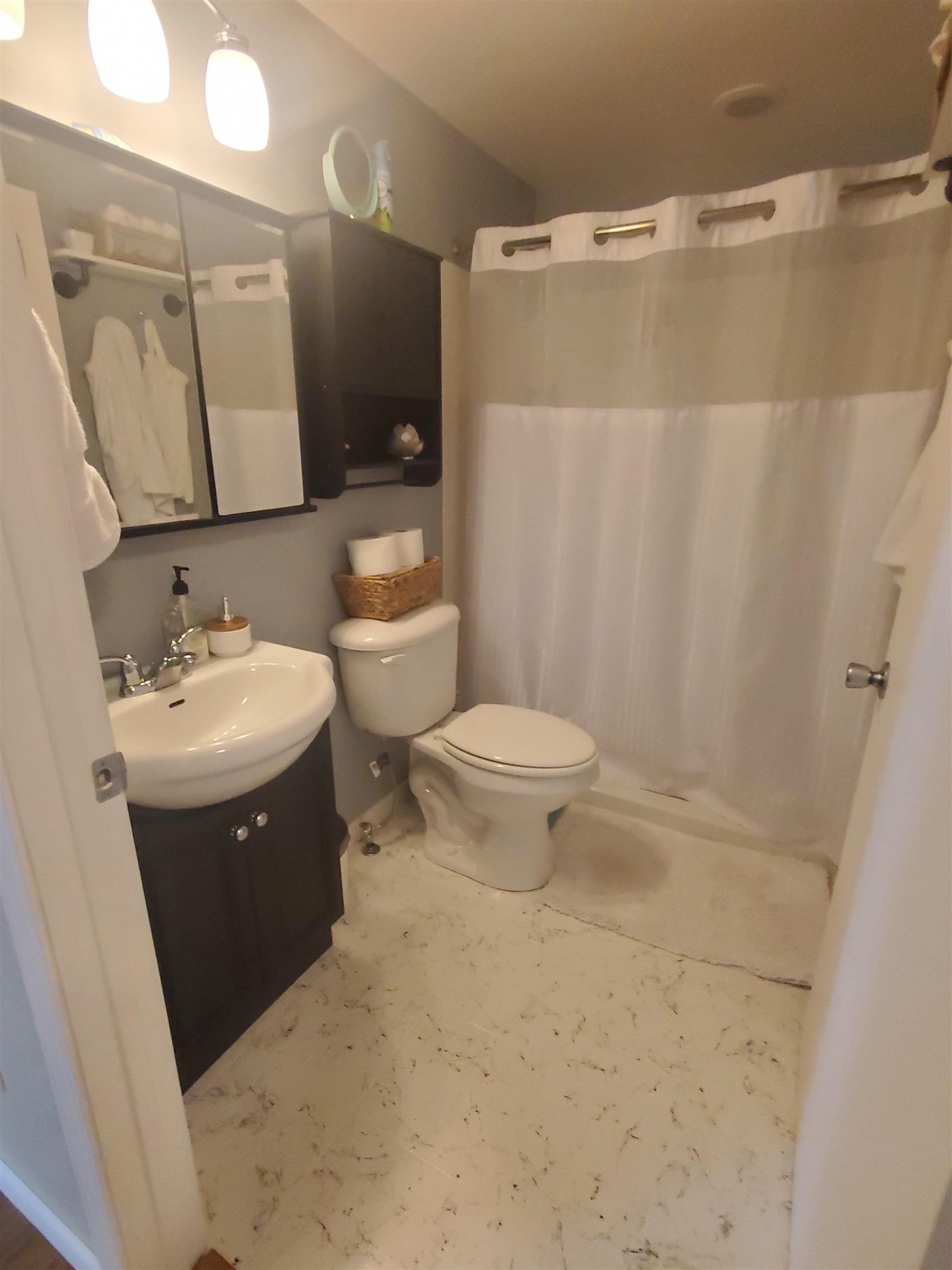 1130 Ritsher Street Beloit, WI 53511 - Photo 9 of 14 a bathroom with a sink a toilet and shower