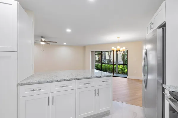 a view of a kitchen cabinets and stainless steel appliances