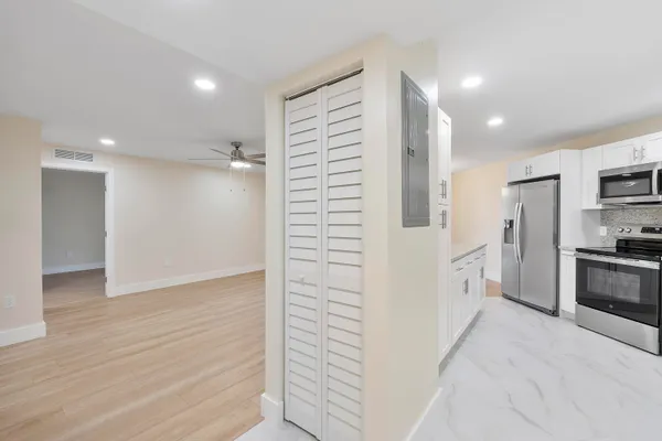 a view of a hallway with washer and dryer