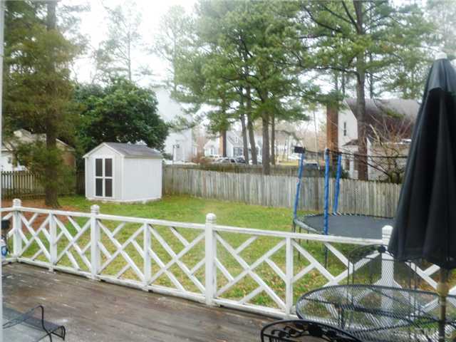 2409 Scouting Trail Raleigh, NC 27615 - Photo 16 of 22 a view of a wooden fence and a bench