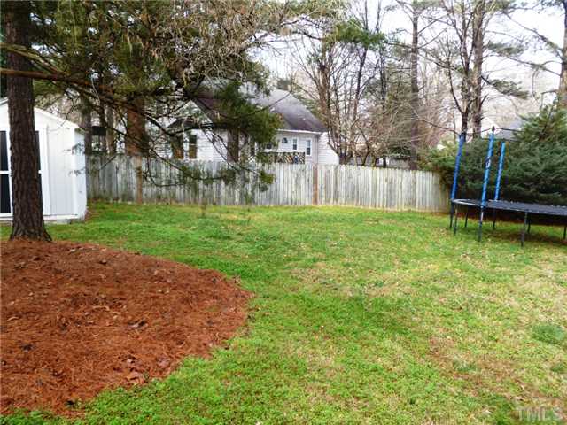 2409 Scouting Trail Raleigh, NC 27615 - Photo 18 of 22 a view of a backyard with large trees