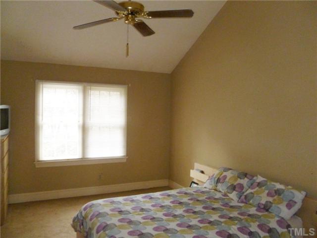 2409 Scouting Trail Raleigh, NC 27615 - Photo 10 of 22 a bedroom with a bed and a window