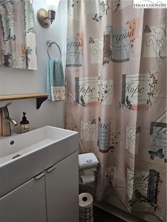 a bathroom with a sink and mirror