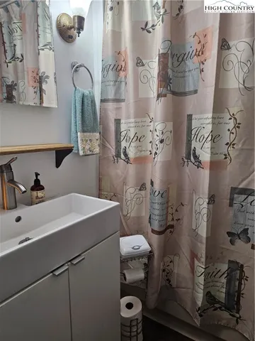 a bathroom with a sink and mirror