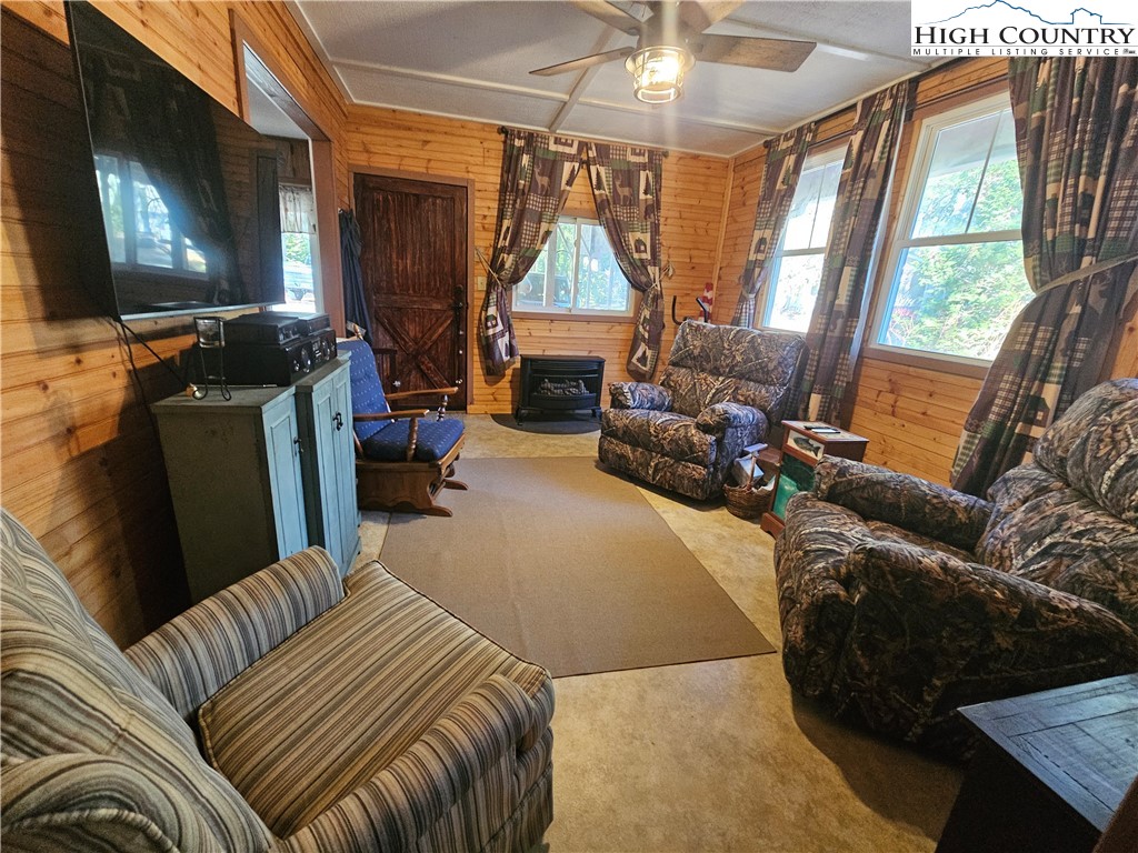 184 Trillium Road Newland, NC 28657 - Photo 7 of 15 a bedroom with furniture and a flat screen tv