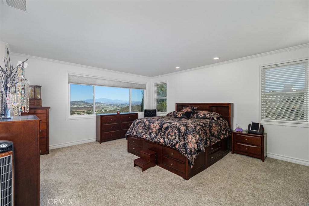 37964 Pinnacle Court Murrieta, CA 92562 - Photo 32 of 47 a spacious bedroom with a bed and a window