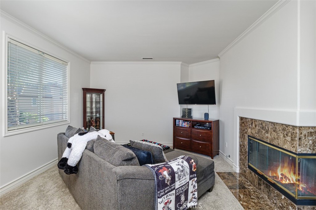 37964 Pinnacle Court Murrieta, CA 92562 - Photo 35 of 47 a living room with furniture and a flat screen tv