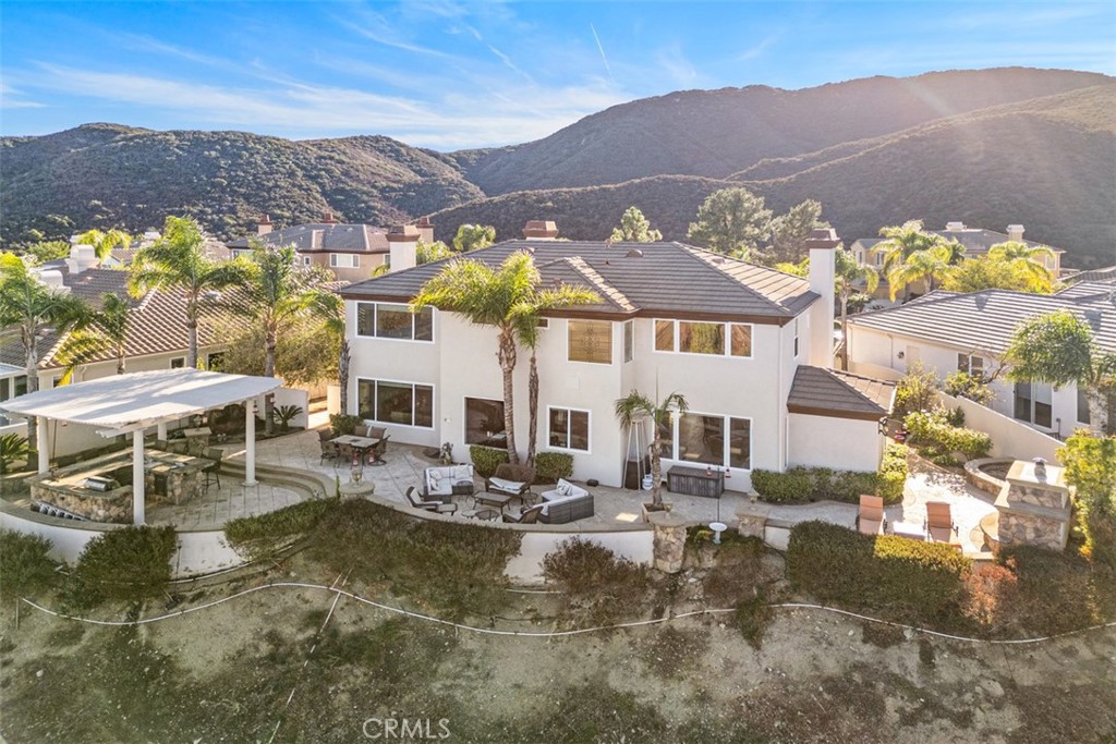 37964 Pinnacle Court Murrieta, CA 92562 - Photo 4 of 47 a view of a patio with swimming pool and a chairs