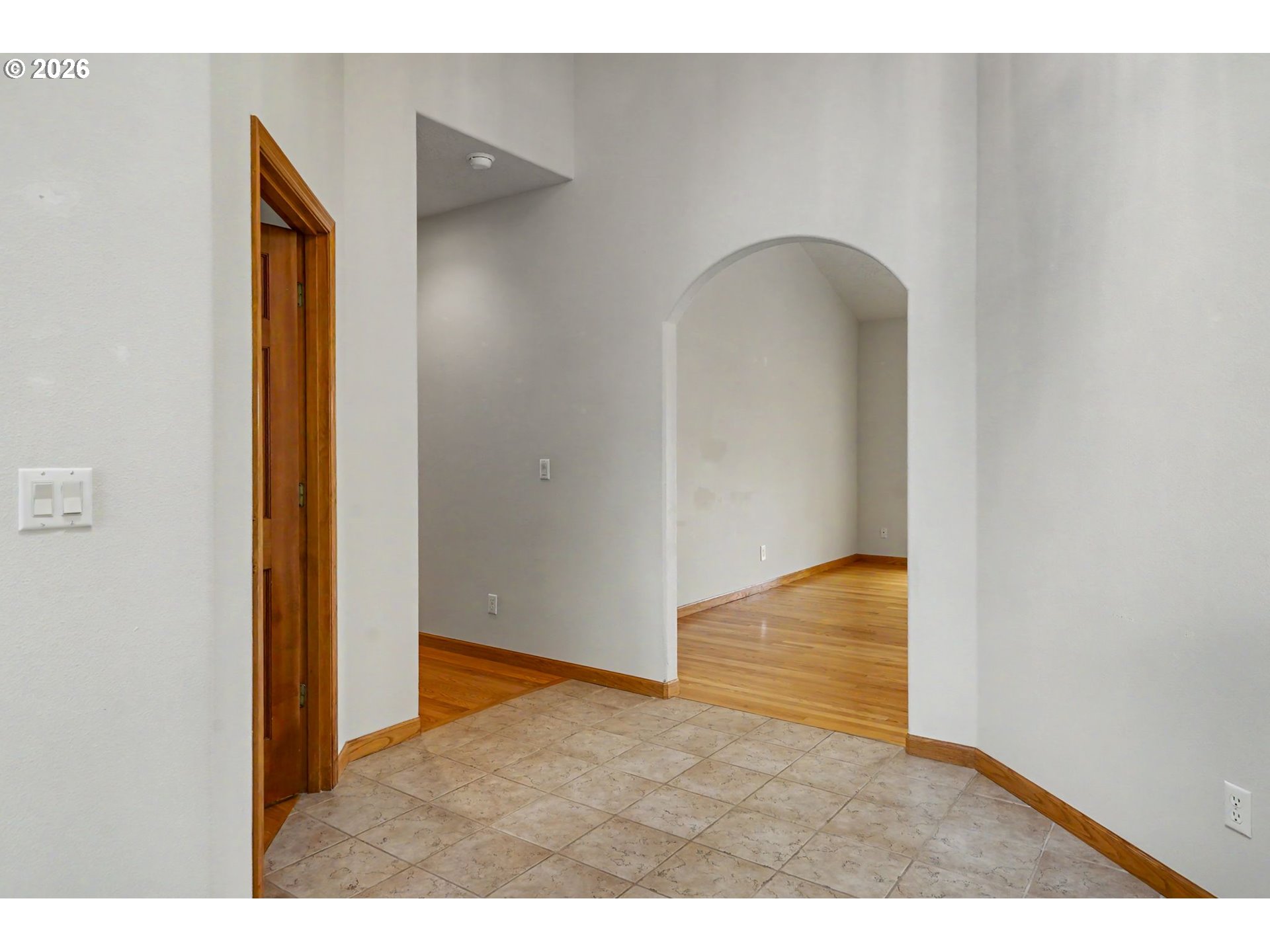 1470 Ranier Loop Northwest Salem, OR 97304 - Photo 5 of 48 a view of an empty room with closet and wooden floor