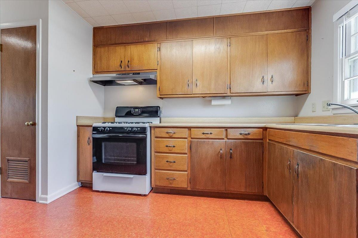 2801 62nd Street Lubbock, TX 79413 - Photo 11 of 21 a kitchen with stainless steel appliances granite countertop a stove and a refrigerator