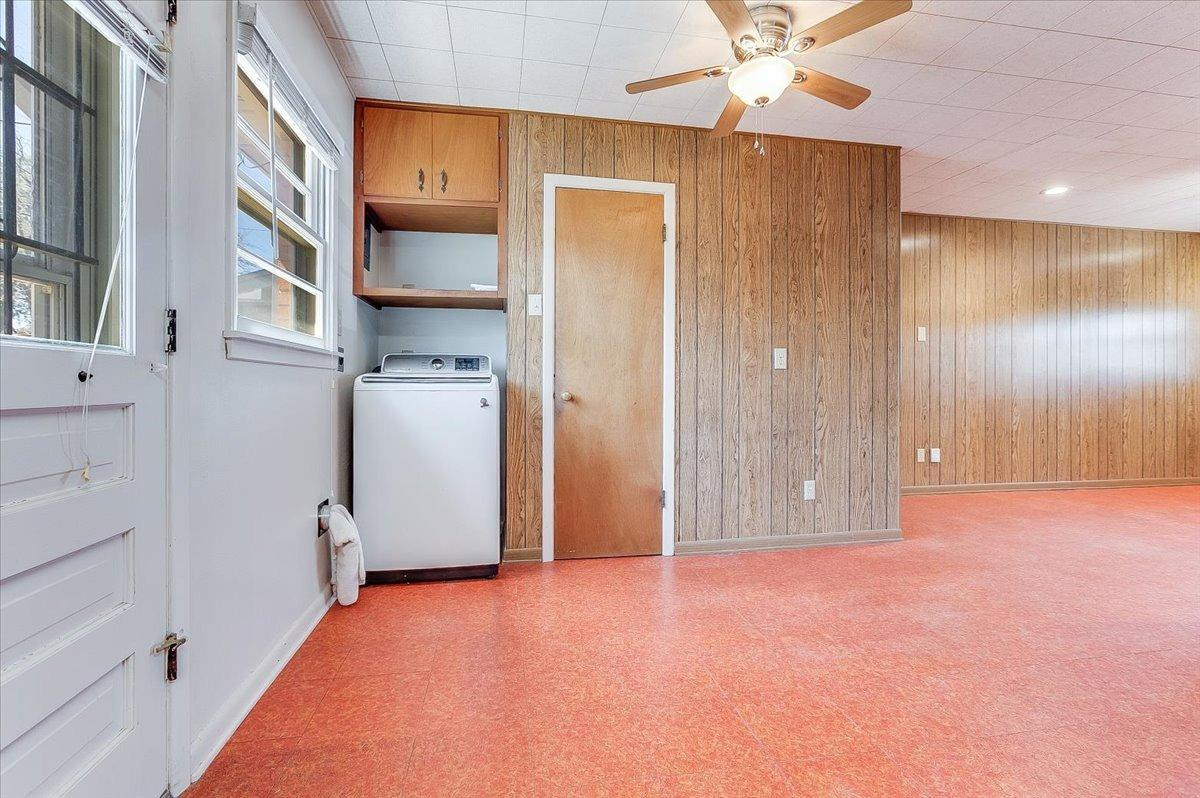 2801 62nd Street Lubbock, TX 79413 - Photo 14 of 21 a view of an empty room with a kitchen