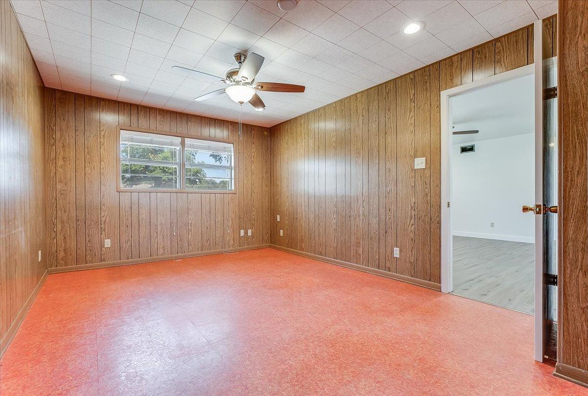2801 62nd Street Lubbock, TX 79413 - Photo 15 of 21 an empty room with windows and fan