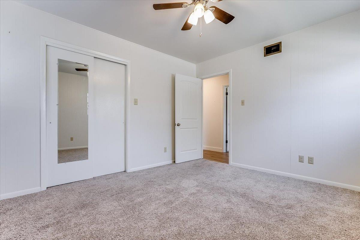 2801 62nd Street Lubbock, TX 79413 - Photo 20 of 21 a view of an empty room with a chandelier fan