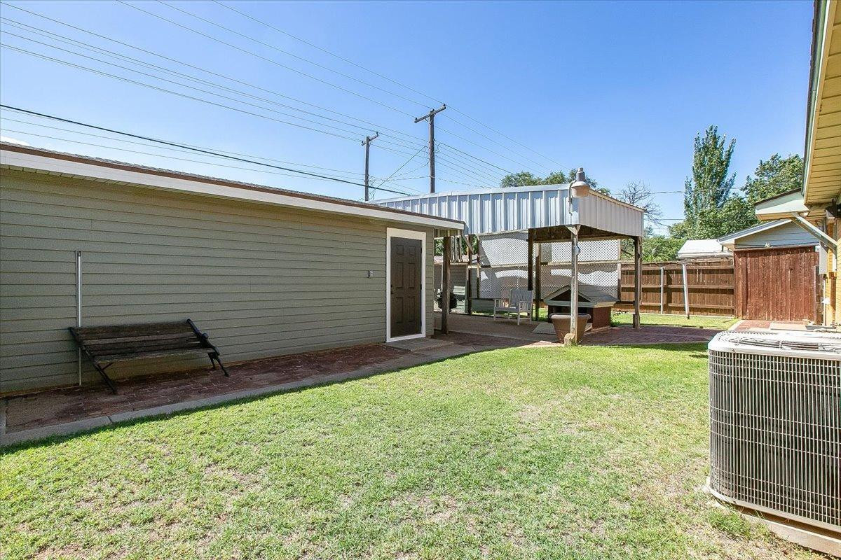 2801 62nd Street Lubbock, TX 79413 - Photo 5 of 21 a view of a backyard with sitting area