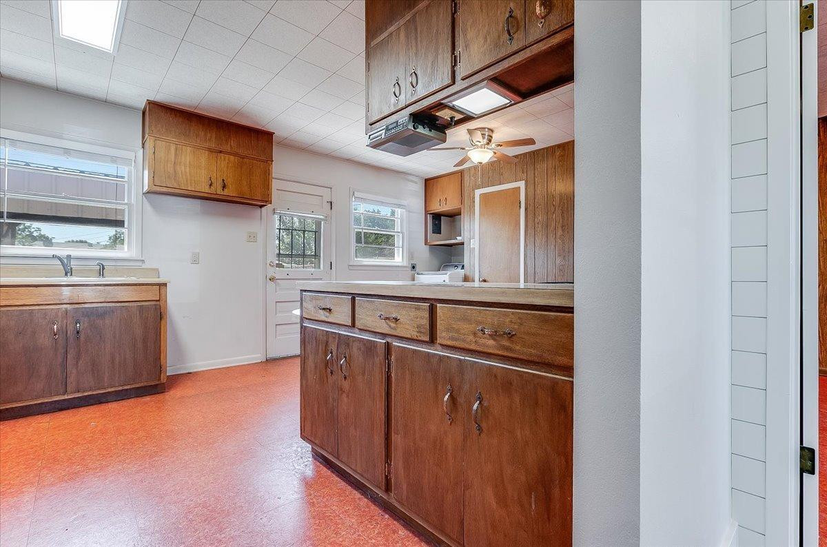 2801 62nd Street Lubbock, TX 79413 - Photo 10 of 21 a kitchen with stainless steel appliances granite countertop a stove a sink and a microwave