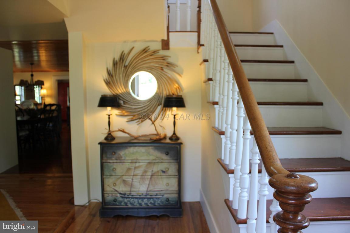 20633 Nanticoke Road Nanticoke, MD 21840 - Photo 14 of 46 a view of entryway and hall with wooden floor