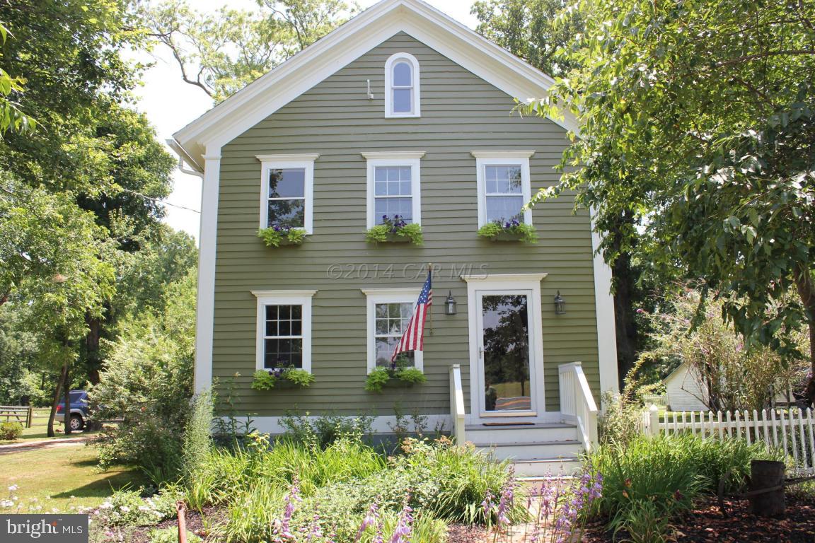 20633 Nanticoke Road Nanticoke, MD 21840 - Photo 5 of 46 a front view of a house with a garden