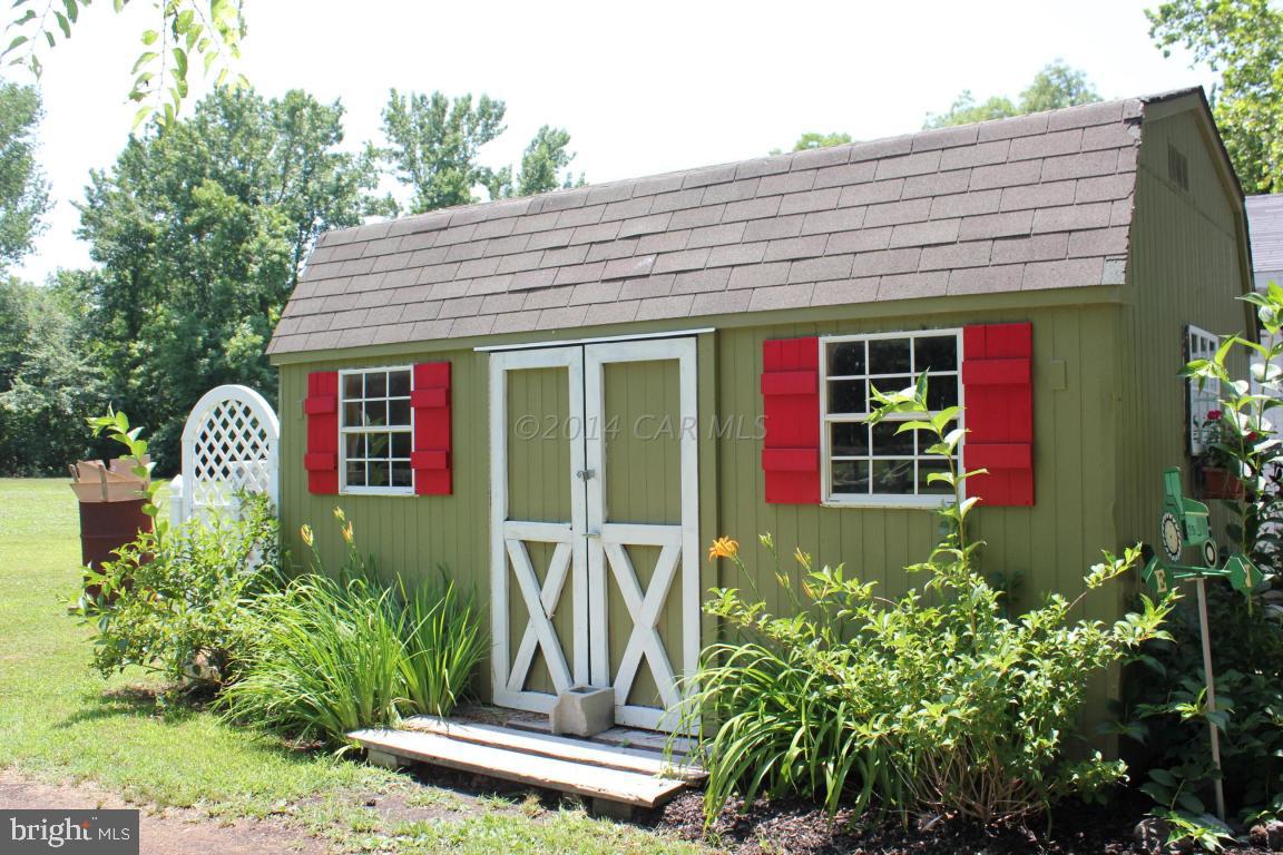 20633 Nanticoke Road Nanticoke, MD 21840 - Photo 41 of 46 a front view of a house with garden