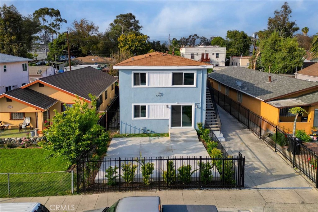 5459 Carlin Street, Unit 1 Los Angeles, CA 90016 - Photo 1 of 22 an aerial view of a house with a yard