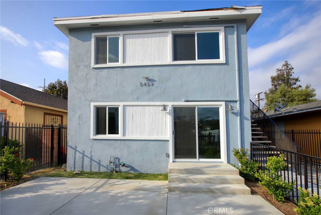 5459 Carlin Street, Unit 1 Los Angeles, CA 90016 - Photo 12 of 22 a front view of a house with a yard