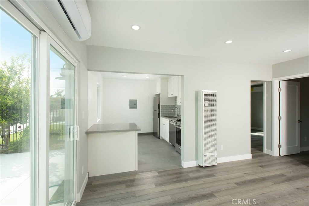 5459 Carlin Street, Unit 1 Los Angeles, CA 90016 - Photo 18 of 22 a view of a refrigerator in kitchen and an empty room