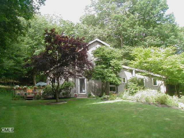 150 Hattertown Road Newtown, CT 06470 - Photo 1 of 1 a front view of a house with a garden