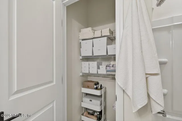 a bedroom with furniture and a book shelf