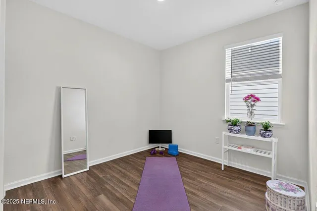 a view of a workspace with furniture and cabinet