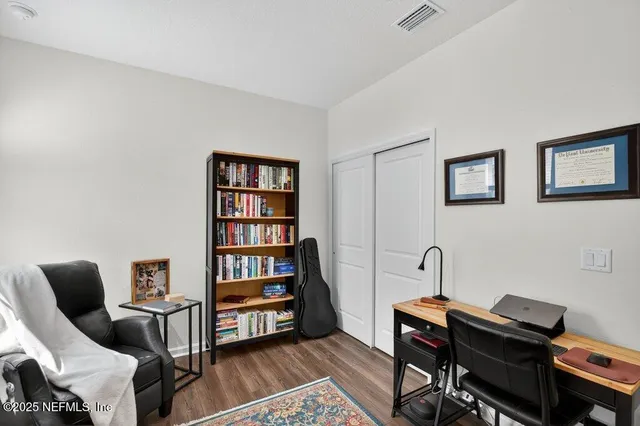 a view of a workspace with furniture