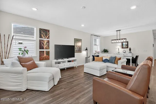 a bathroom with a sink vanity granite tub shower and mirror