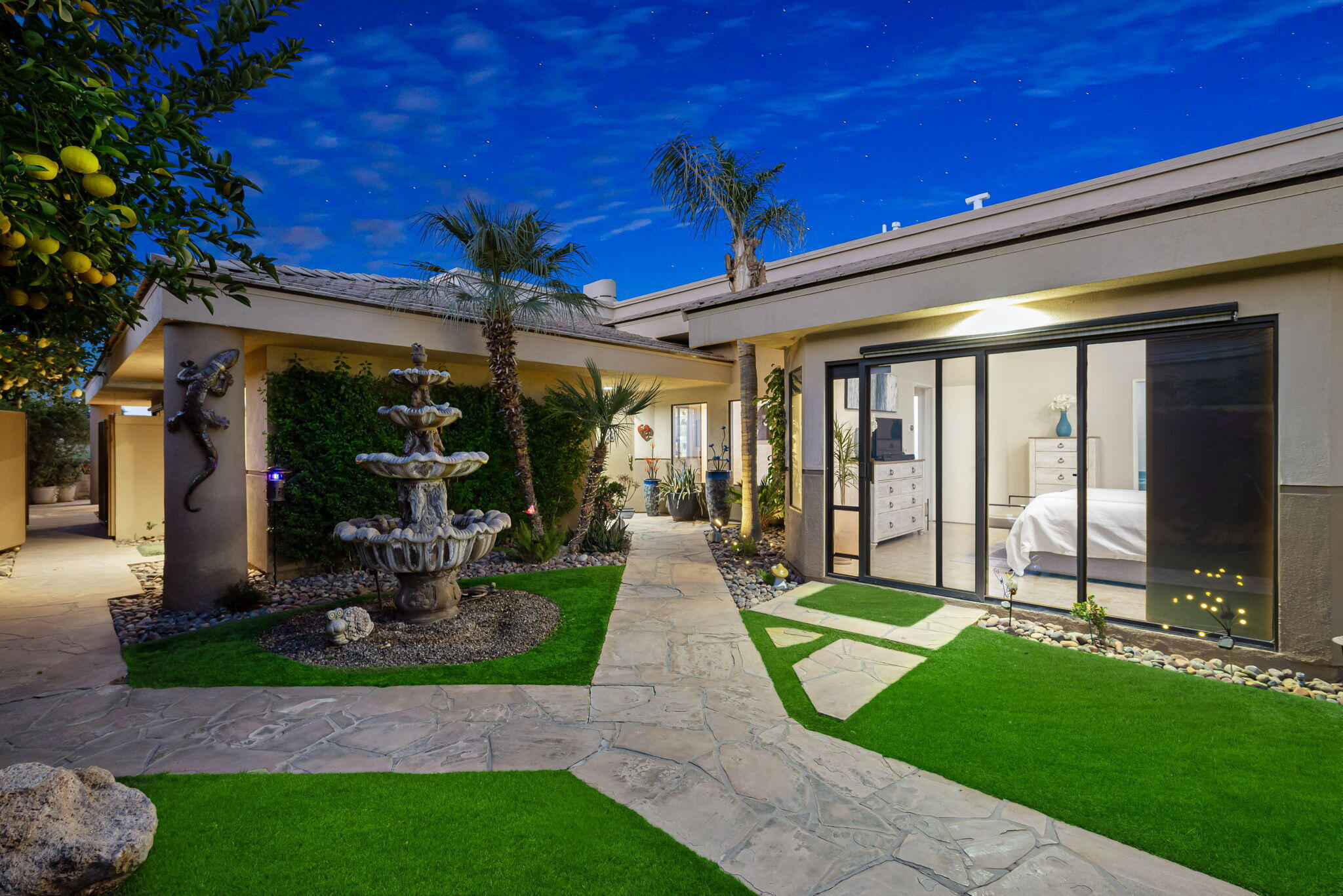 80449 Pebble Beach La Quinta, CA 92253 - Photo 19 of 60 a view of a patio with table and chairs potted plants and large tree