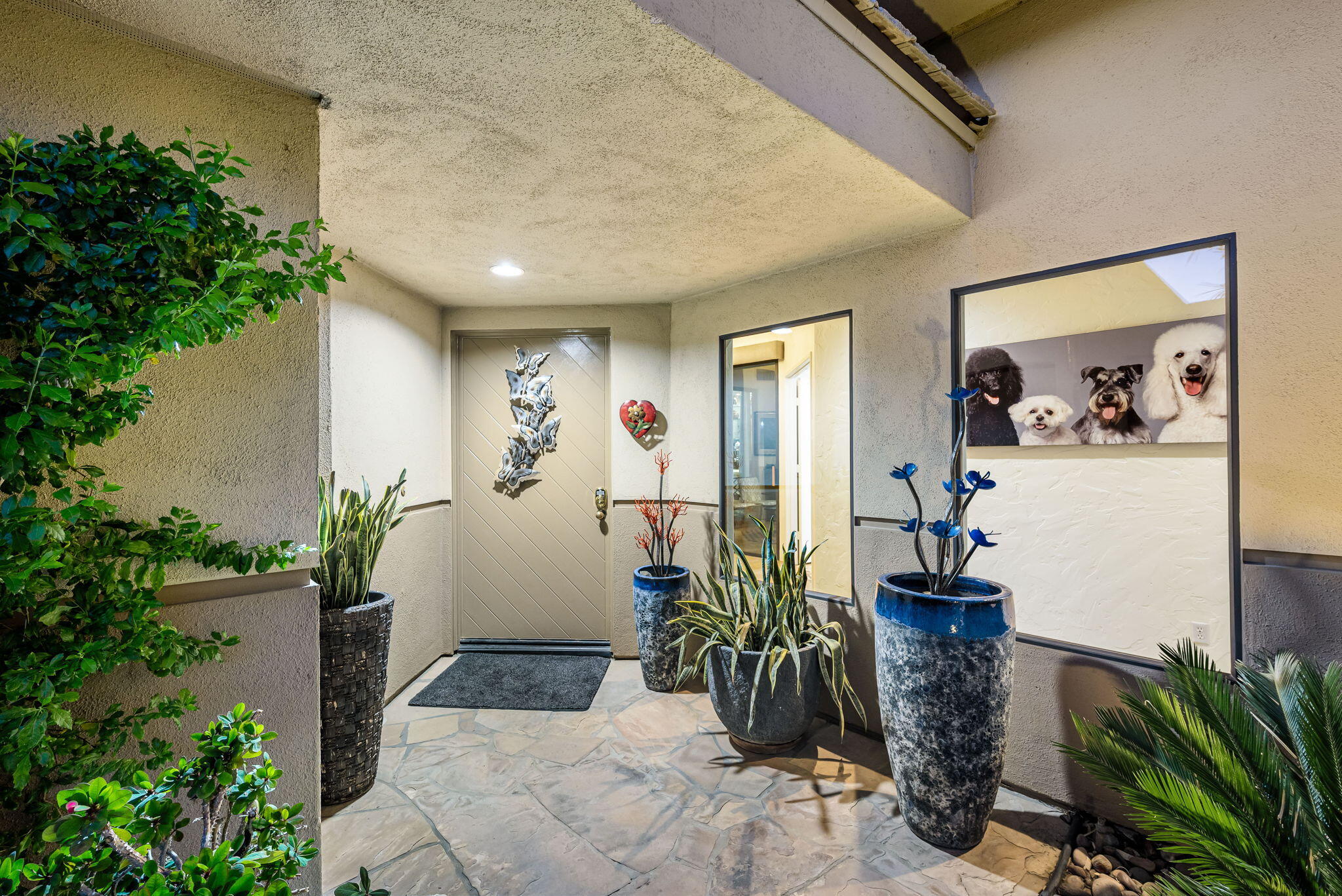 80449 Pebble Beach La Quinta, CA 92253 - Photo 24 of 60 a house with potted plants in front of it