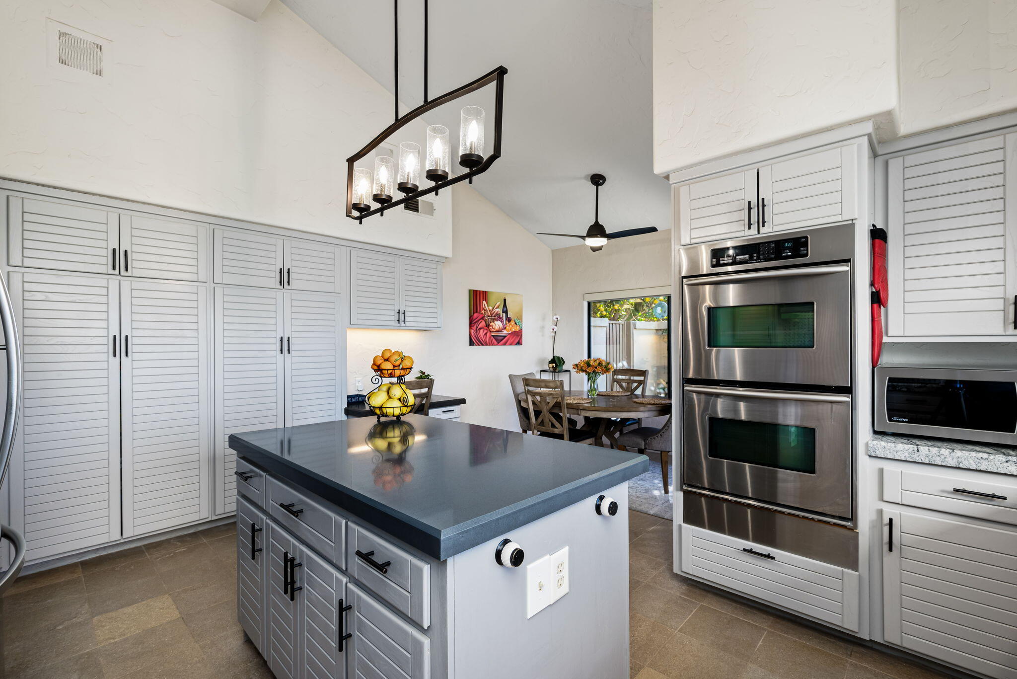 80449 Pebble Beach La Quinta, CA 92253 - Photo 38 of 60 a kitchen with stainless steel appliances a stove microwave and refrigerator