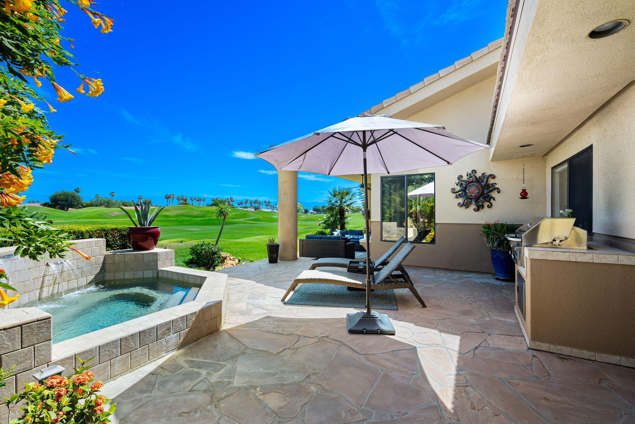 80449 Pebble Beach La Quinta, CA 92253 - Photo 5 of 60 a view of a terrace with chairs and potted plants