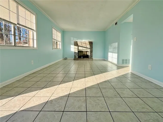 a view of an empty room and window