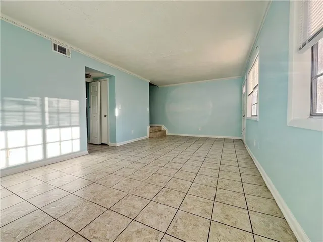 a kitchen with stainless steel appliances granite countertop a sink and a stove