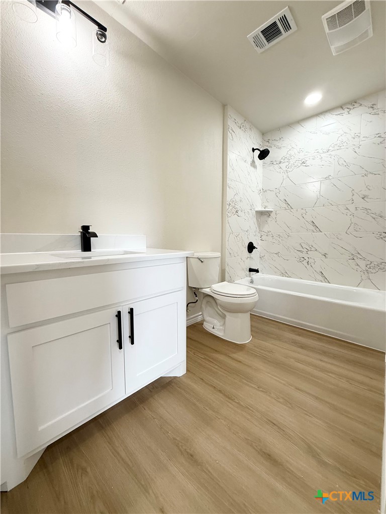 421 South 32nd Street Temple, TX 76501 - Photo 15 of 27 a bathroom with a sink a toilet and shower