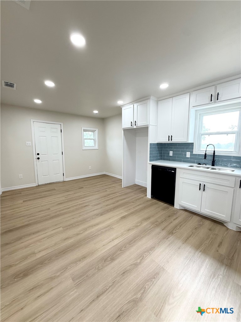 421 South 32nd Street Temple, TX 76501 - Photo 7 of 27 a large kitchen with kitchen island a sink stainless steel appliances and cabinets