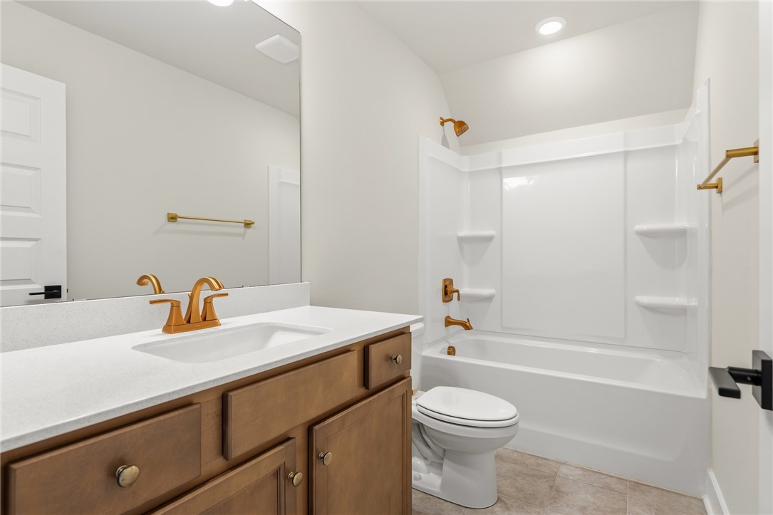 319 Summerall Drive Anderson, SC 29621 - Photo 32 of 37 This bright bathroom features a spacious vanity with elegant fixtures and a pristine tub.