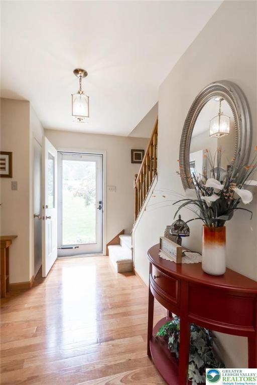 4759 Egypt Road Coplay, PA 18037 - Photo 10 of 30 a dining room with wooden floor and a chandelier