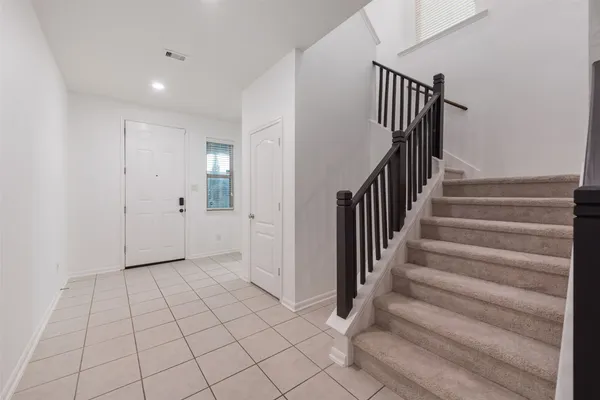 a view of an entryway with stairs
