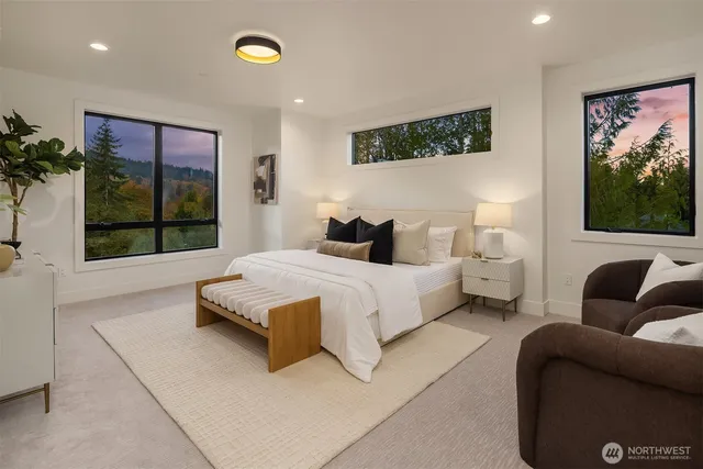 a bedroom with a bed window and couch