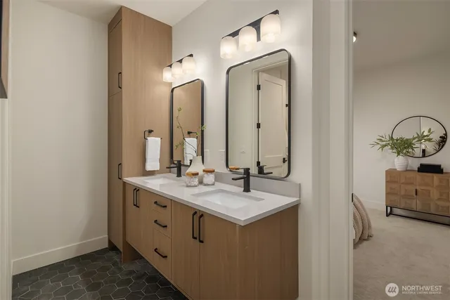 a bathroom with a double vanity sink and mirror