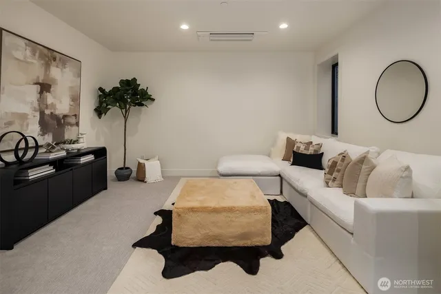 a living room with furniture and a mirror