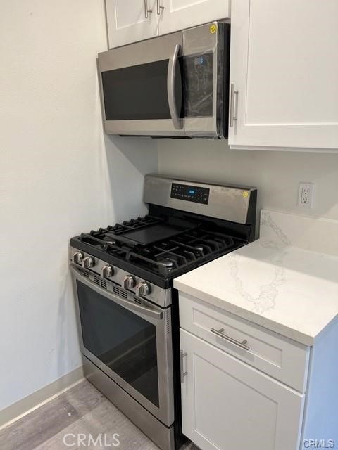 237 West Wilson Avenue Orange, CA 92867 - Photo 8 of 8 a stove top oven sitting inside of a kitchen