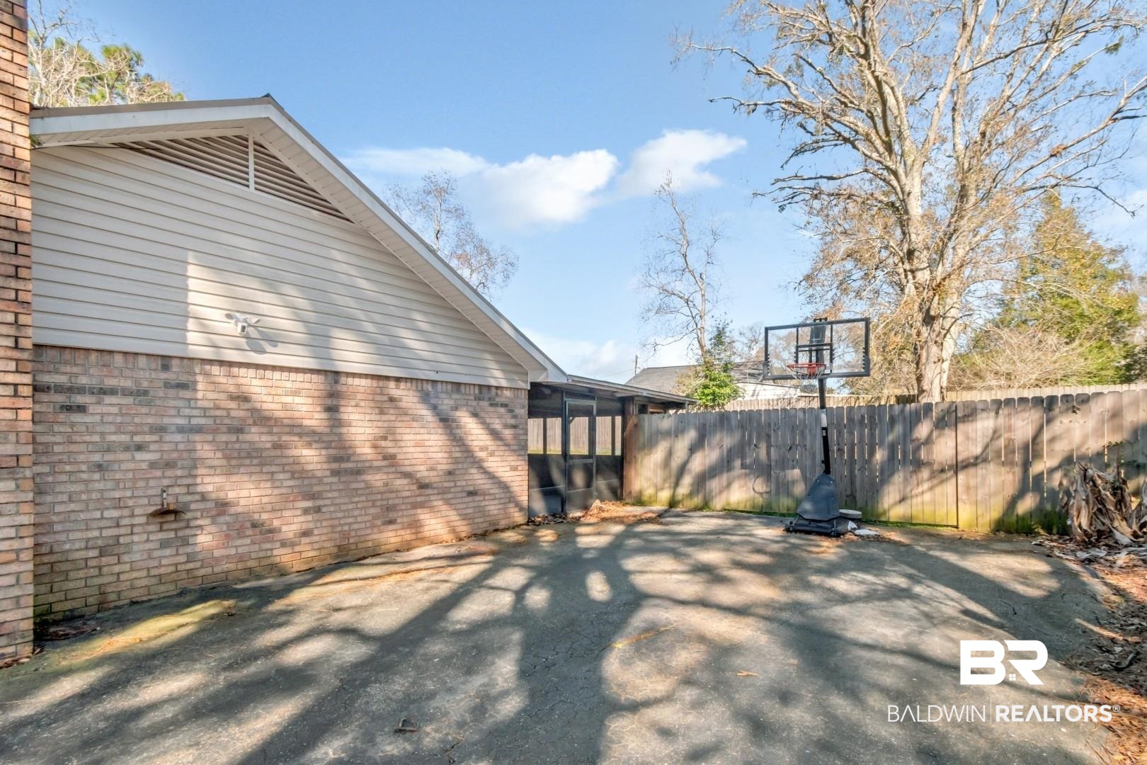 9410 Ashwood Court Mobile, AL 36695 - Photo 4 of 20 View of patio featuring a sunroom